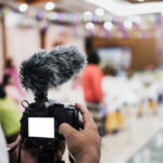 cameraman-video-professional-digital-mirror-less-tripod-camera-recording-with-microphone_4236-1351
